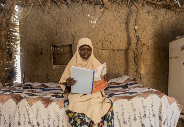 Zahara Reading a book with a smile