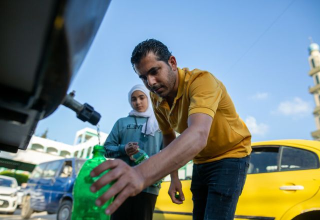Families in Gaza collecting water