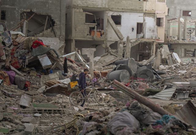 Man travelling to his home or the remains of his home in North Gaza Governorate.