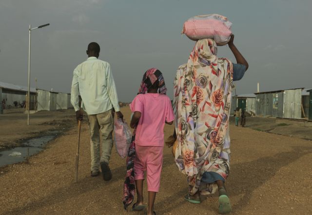 Khamis Adam Mohammed, 33, and his family arrive at the transit centre in Renk after arriving from war torn Sudan.