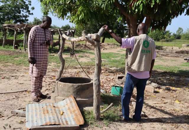 Damaged well in Bla after torrential rains in July–August 2024, with two men inspecting the site.