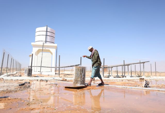 Abdirisak Salad checks water quality at a well site in Boocame District, Sool Region.