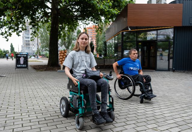 Danylo* joins his friend, Anastasia*, to test a specially equipped taxi that Anastasia's business will soon provide people with disabilities in Mykolaiv city.