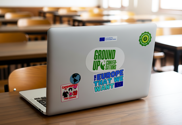 Laptop with Ground Up and The Europe We Want stickers