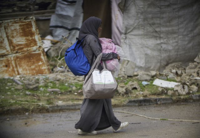 young girl walking with bags