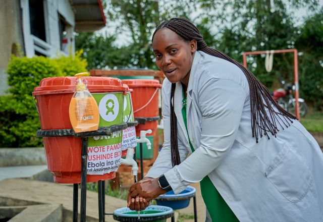Chantal Kasemire, Head Nurse, using handwashing kit at the Shari Health Centre.