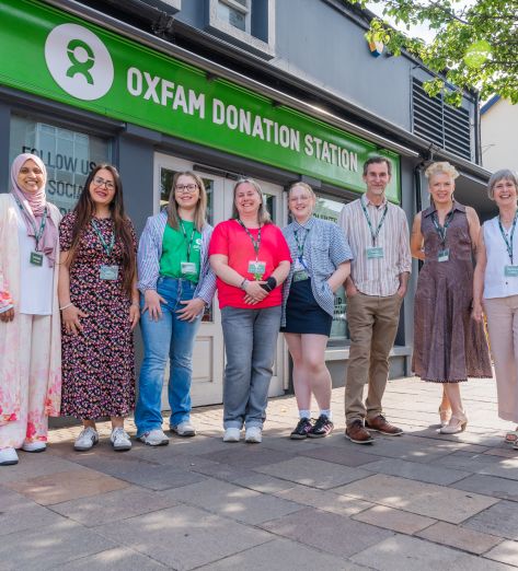 Group picture with staff and volunteers in front of the Oxfam Holywood superstore.