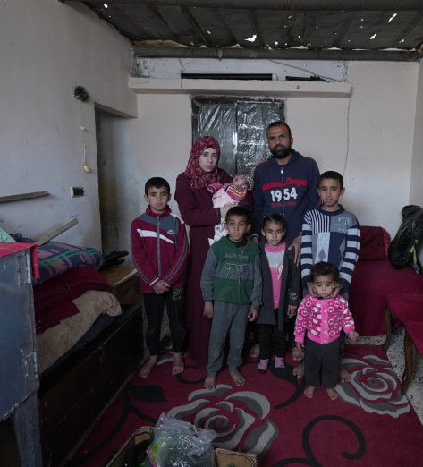 Suhad, her husband, 5 children and a new born struggling to find food.
