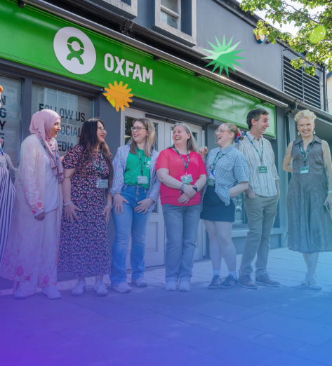 Groups of staff and volunteers in front of an Oxfam Ireland's Shop