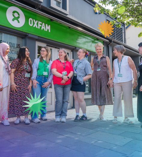 Groups of staff and volunteers in front of an Oxfam Ireland's Shop