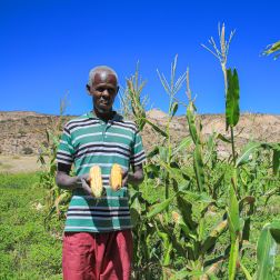 Farmer holding his farm production.