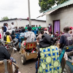 group of people waiting waiting to receive Non-food items (NFIs) from Oxfam partners
