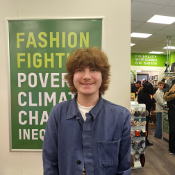 Marius, Volunteer from Norway standing in an Oxfam shop