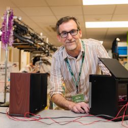 Volunteer David testing a donated CD player at one of our Oxfam Shop
