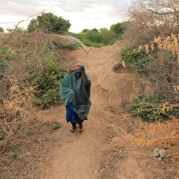 Saada Abdulahi carrying jerrycan of water.