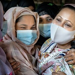 Women laughing at the RWWS women's centre inside a camp in Cox's Bazar, Bangladesh