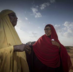 Ibaado Mohamed and woman talking