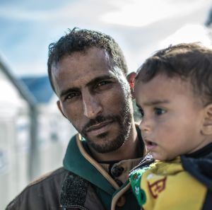 Omar* (27 years old), and his 2-year-old son. From Hassaka, Syria