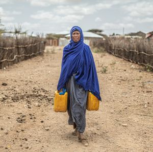 Amina Ibrahim collecting water for her family