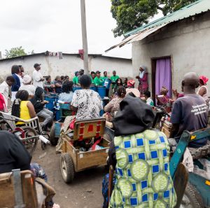 group of people waiting waiting to receive Non-food items (NFIs) from Oxfam partners