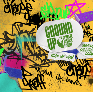 A graffiti wall with a sticker in the middle with the Ground Up Climate Justice Forum logo and stickers saying Sign Up Now and University College Cork
