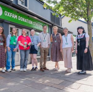 Group picture with staff and volunteers in front of the Oxfam Holywood superstore.