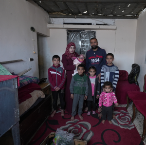 Suhad, her husband, 5 children and a new born struggling to find food.