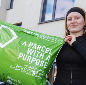 Oxfam staff showing Postback bag